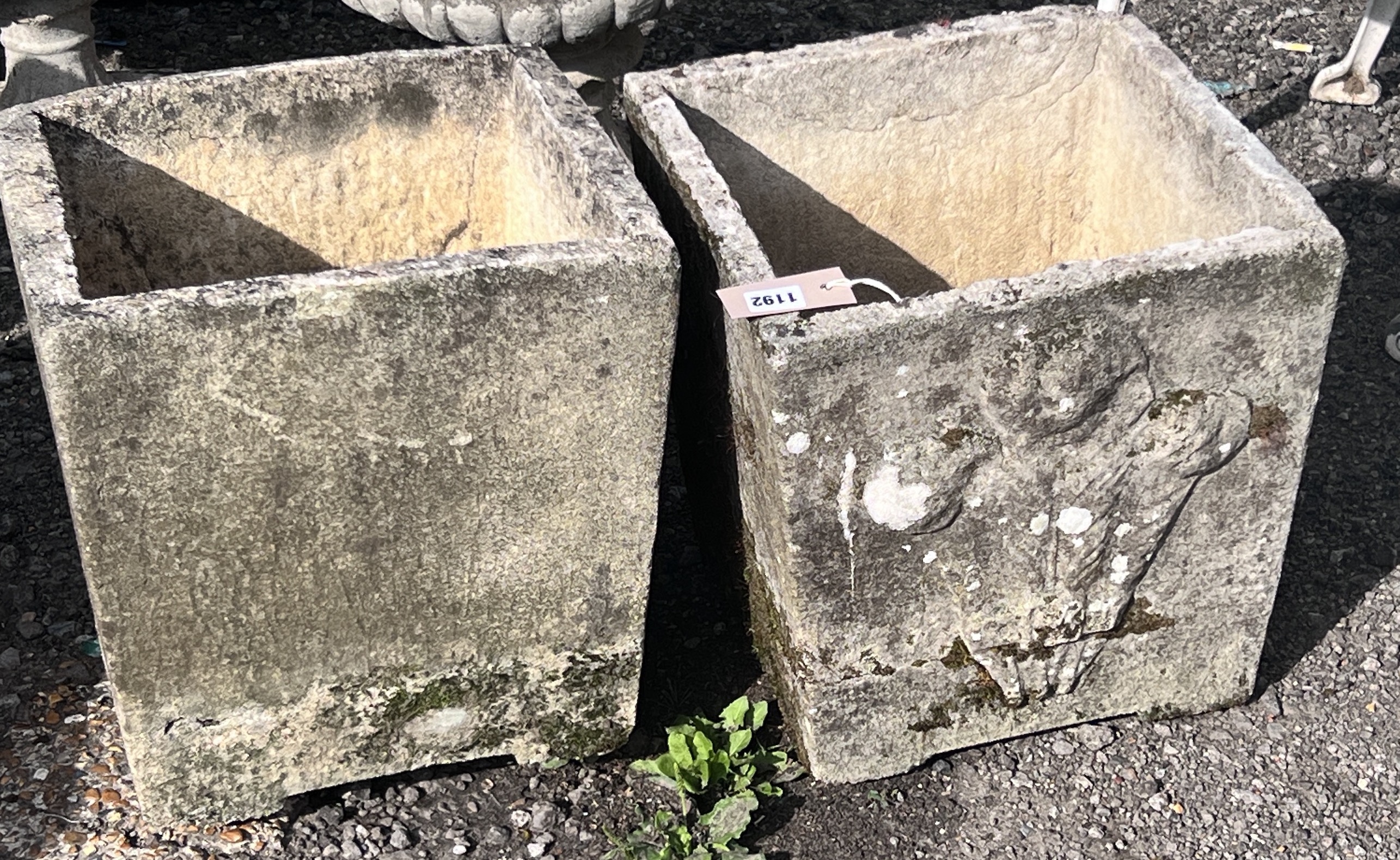 Two composition square tapering planters, 'Prince of Wales feathers', width 34cm, height 37cm